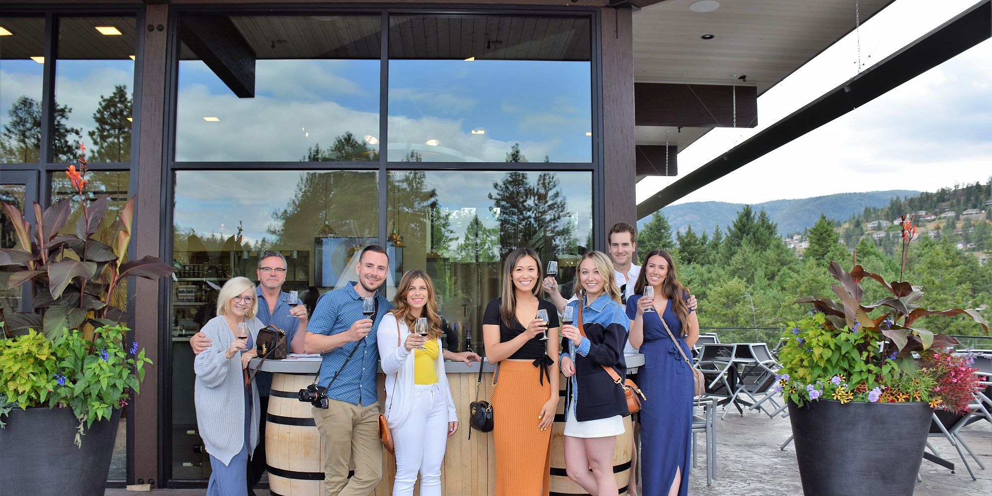 Family Of Eight Enjoying A Private Wine Tasting On Indigenous World Wineries Patio