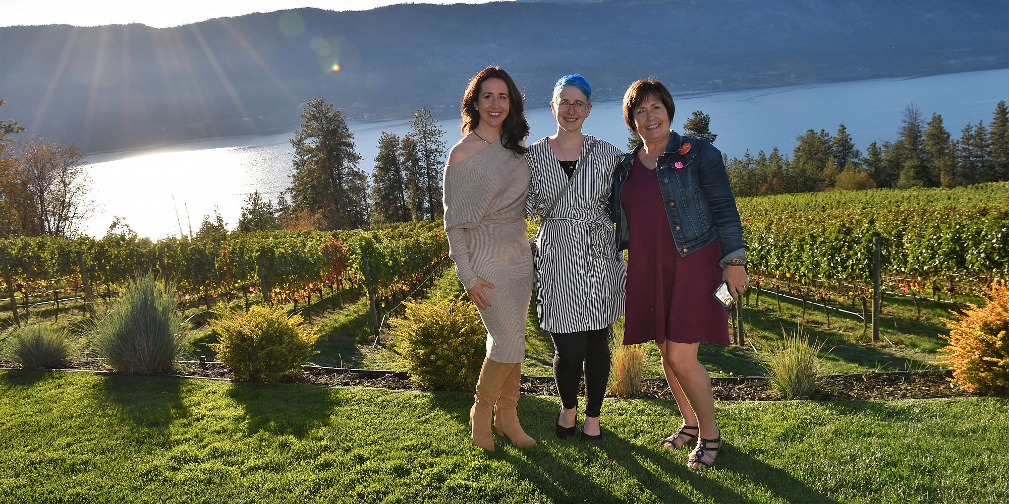 Mother And Two Daughters Overlooking Lake Okanagan And The Vineyard At Arrowleaf Cellars