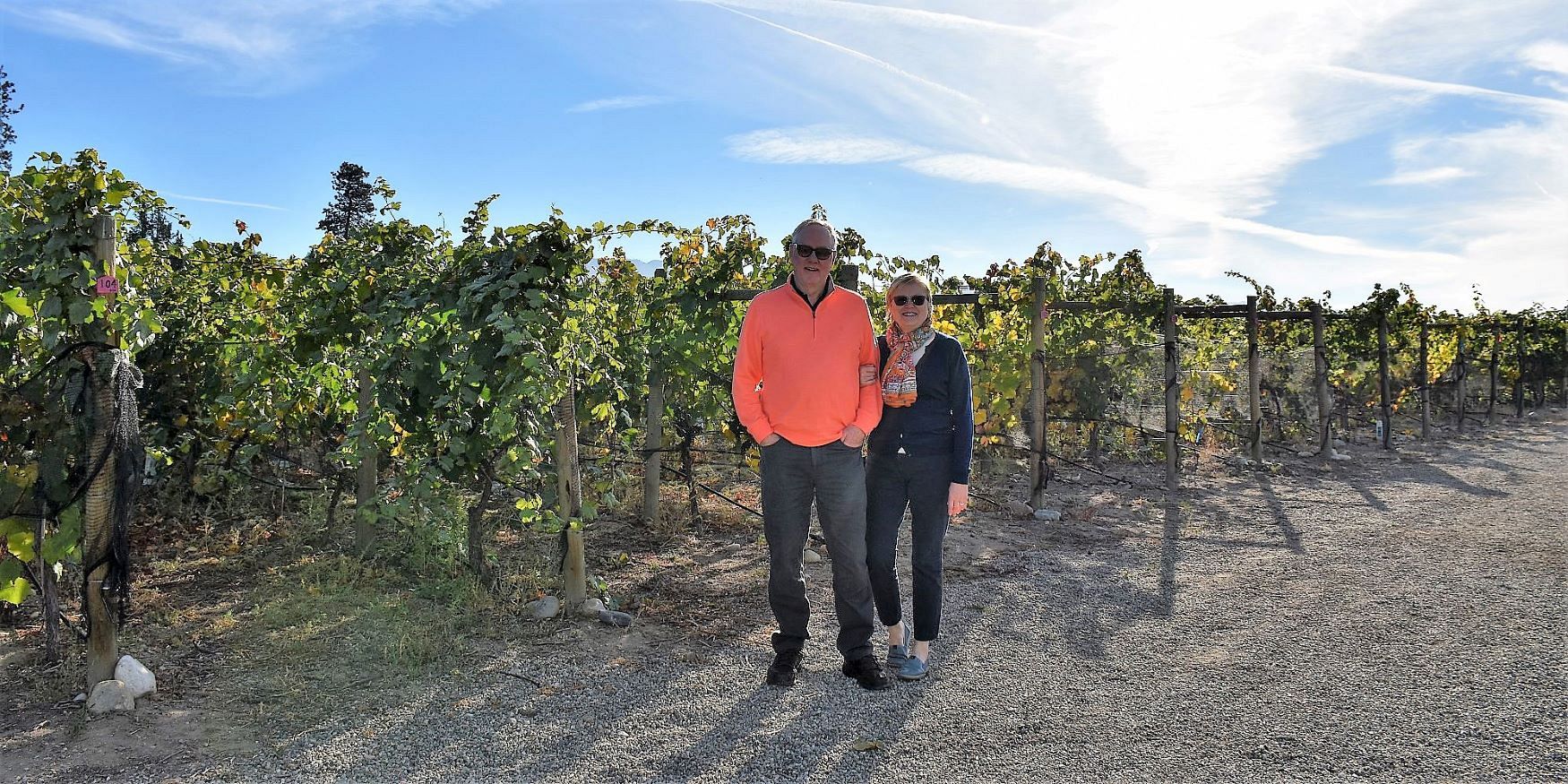 A Happy Couple Standing In The Vineyard At Spearhead Winery