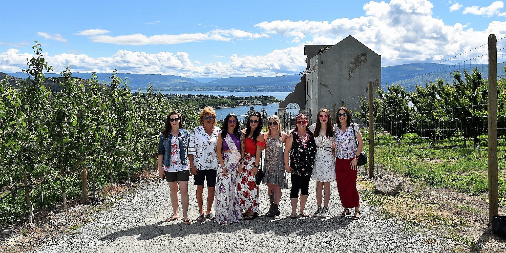 Bridal Party of Eight Standing In Front Of The Crown & Thieves Winery Ruined Castle