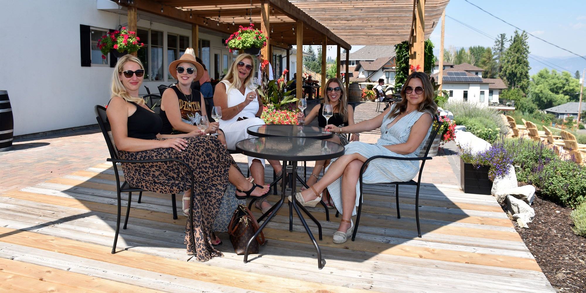 Five Ladies Enjoying A Seated Wine Tasting At Lunessence Vineyard