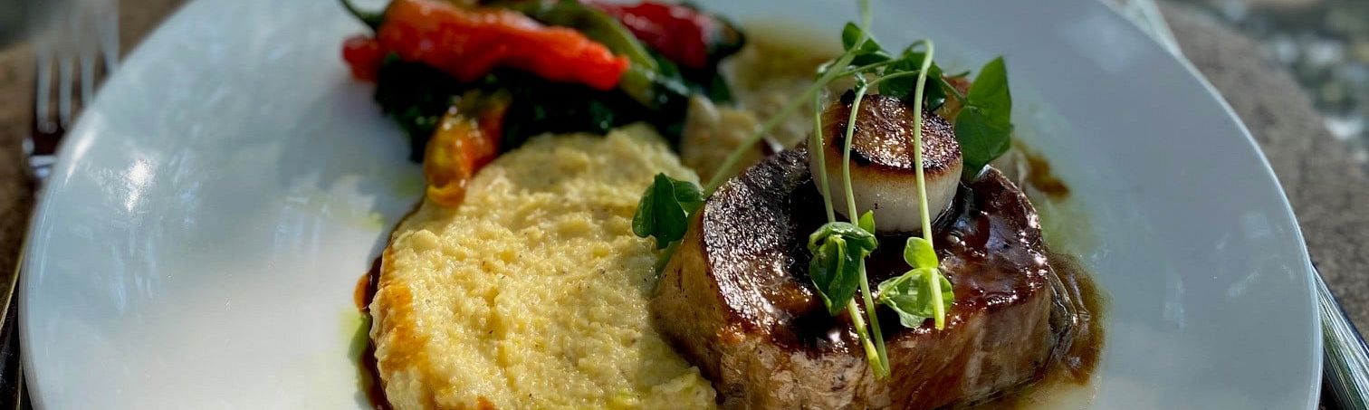 Delicious Pork Shoulder, Scallop, Peppers and Mashed Veggie plate on the Patio at Old Vines Resturant