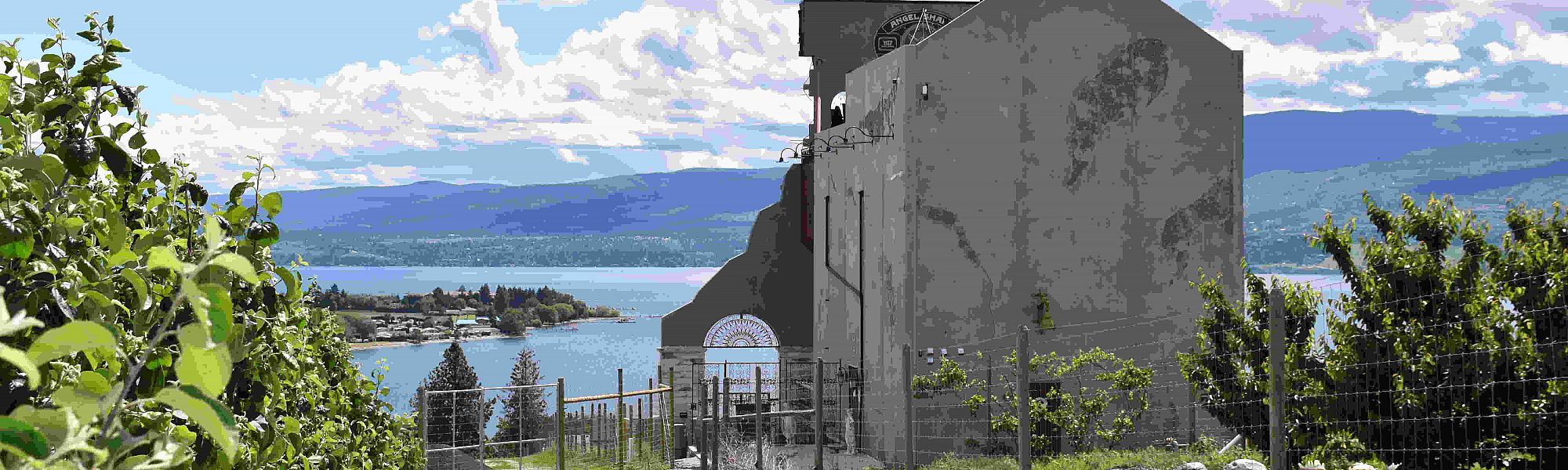 Crown & Thieves Winery surrounded by orchard overlooking Okanagan Lake, BC