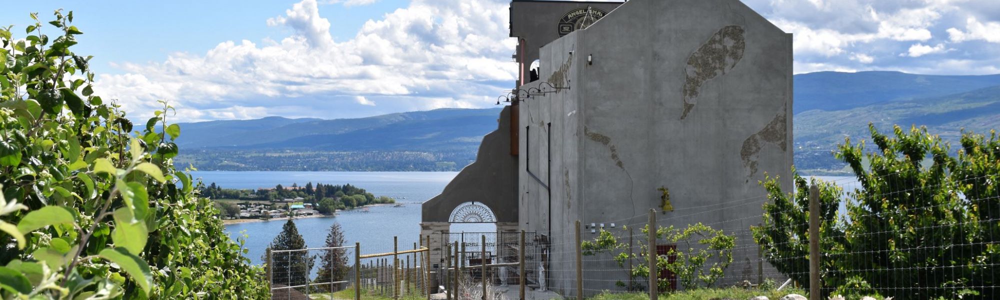 Grape Vines and Apple Orchard surround the Crown & Thieves Winery overlooking Okanagan Lake in West Kelowna.