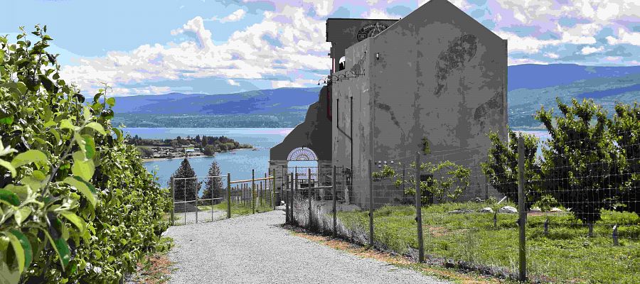 Crown & Thieves Winery surrounded by orchard overlooking Okanagan Lake, BC